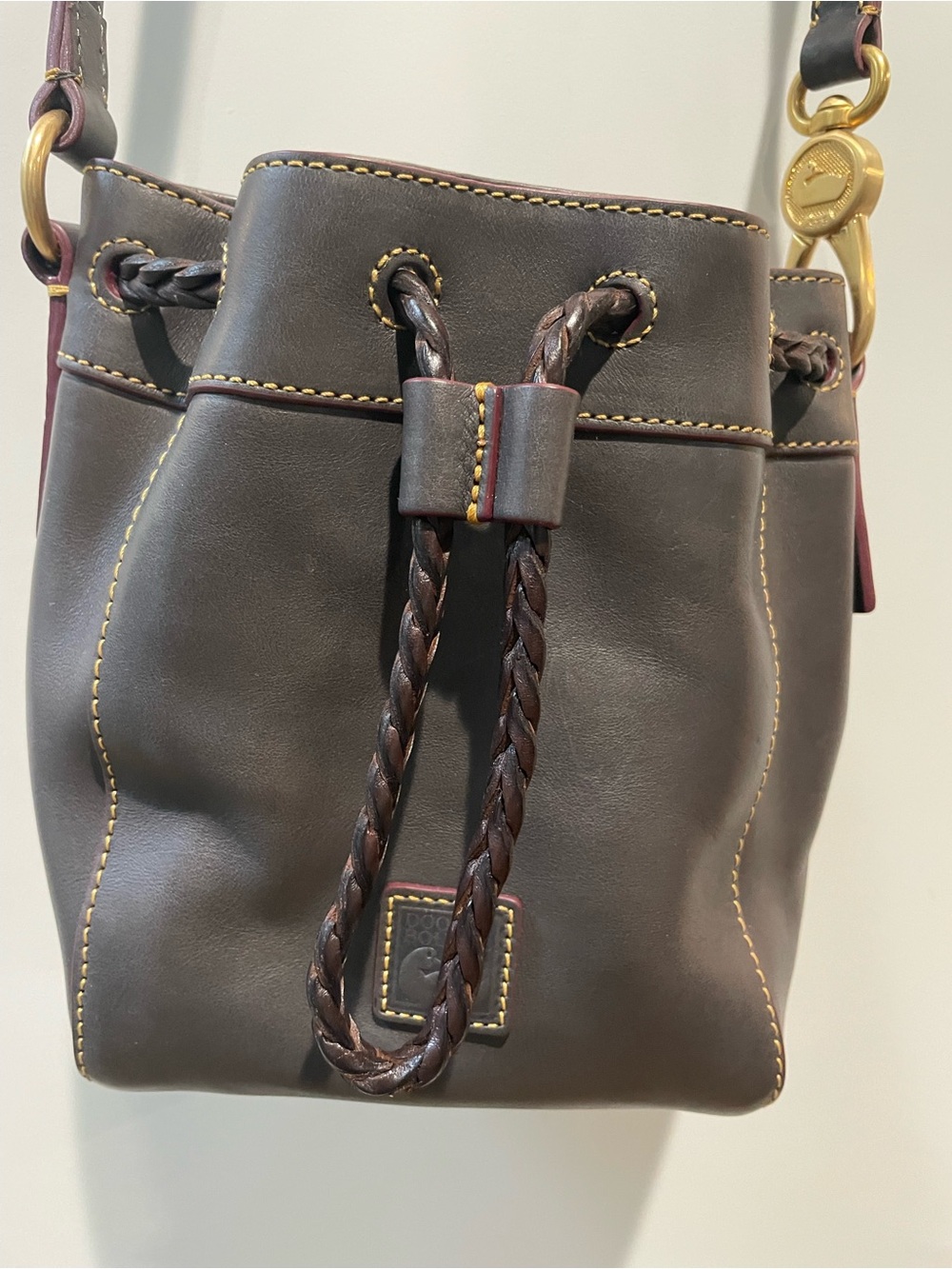 Dooney & Bourke All Weather Dark Olive Leather Drawstring Bucket Crossbody